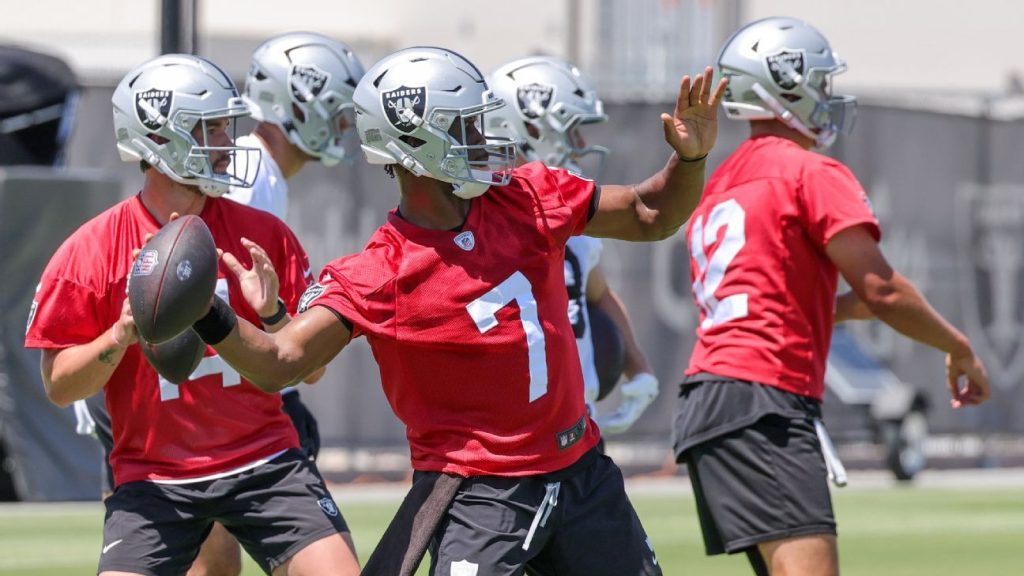 Raiders staff and players celebrate quarterback smith's performance