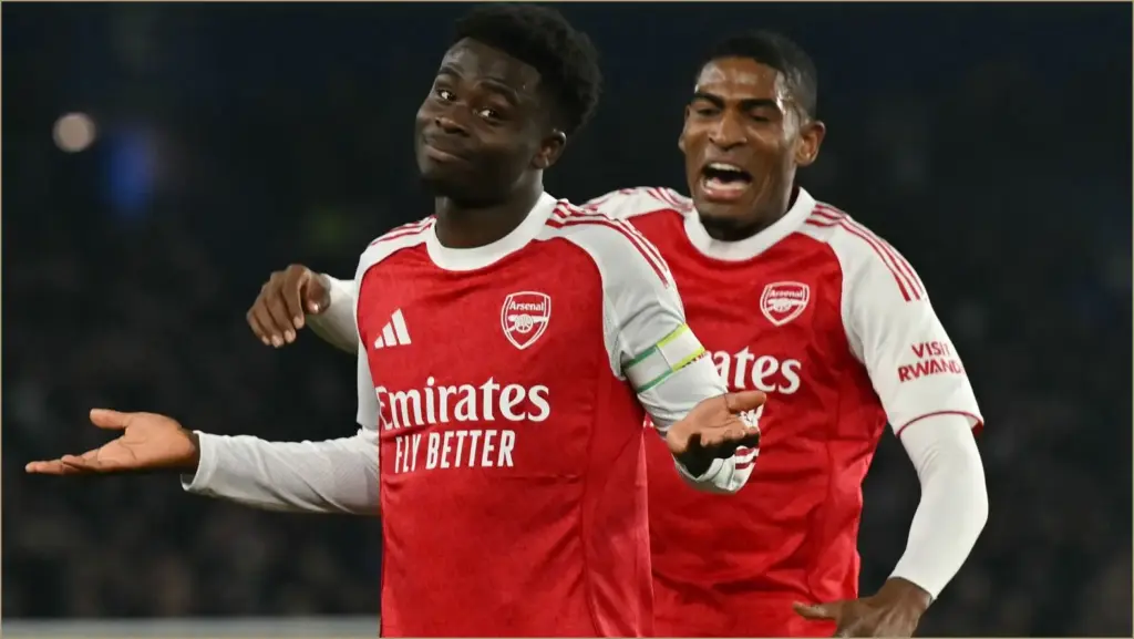 Arsenal extends lead at premier league summit with saka's early